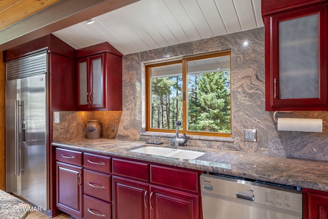 38684 State Route 373, Greer, AZ 85927 - kitchen with stainless steel appliances, reddish brown cabinets, tasteful backsplash, and glass insert cabinets