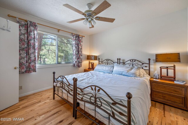 38684 State Route 373, Greer, AZ 85927 - bedroom with light wood-style floors and a ceiling fan