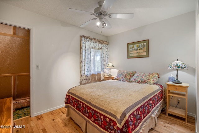 38684 State Route 373, Greer, AZ 85927 - bedroom with light wood-style flooring and a ceiling fan
