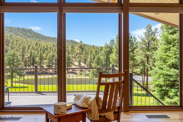 38684 State Route 373, Greer, AZ 85927 - doorway featuring a view of trees and wood finished floors