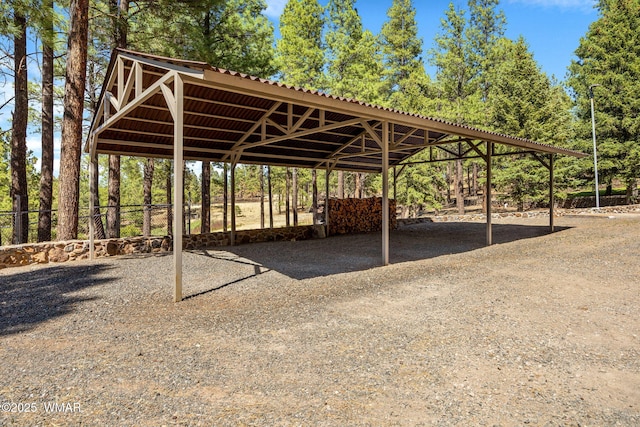 38684 State Route 373, Greer, AZ 85927 - view of parking / parking lot featuring a carport, driveway, and view of scattered trees