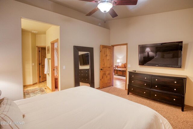 3240 W Black Oak Loop, Show Low, AZ 85901 - bedroom featuring light carpet, ensuite bath, and a ceiling fan