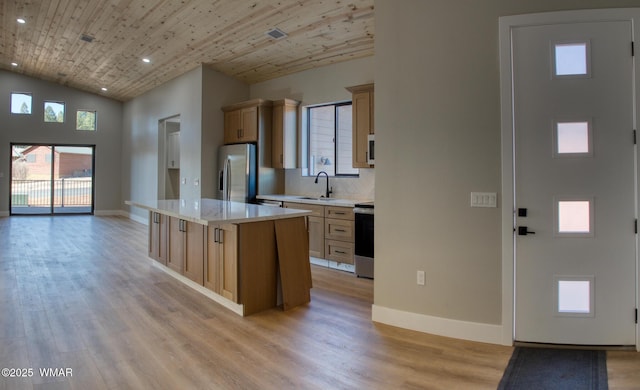 4696 W Tatanka Loop, Show Low, AZ 85901 - kitchen with stainless steel fridge, stove, light wood-style floors, a sink, and recessed lighting