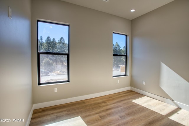 4696 W Tatanka Loop, Show Low, AZ 85901 - empty room featuring wood finished floors, baseboards, and recessed lighting