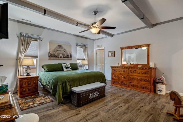 721 S Reynolds Ln, Show Low, AZ 85901 - bedroom featuring multiple windows, wood finished floors, and a ceiling fan