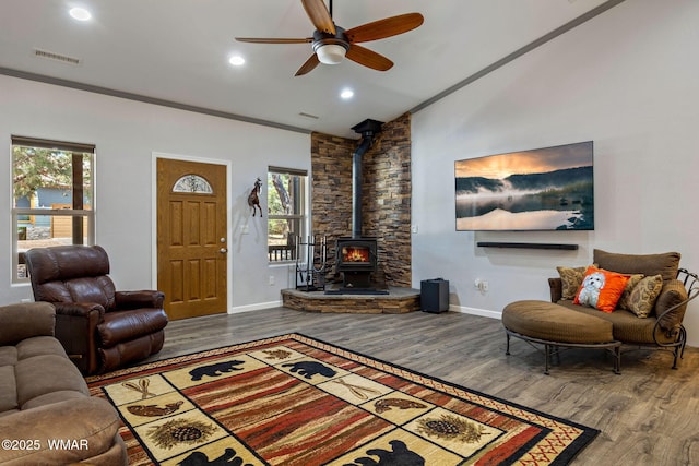 721 S Reynolds Ln, Show Low, AZ 85901 - living area featuring a wood stove, wood finished floors, lofted ceiling, ceiling fan, and recessed lighting
