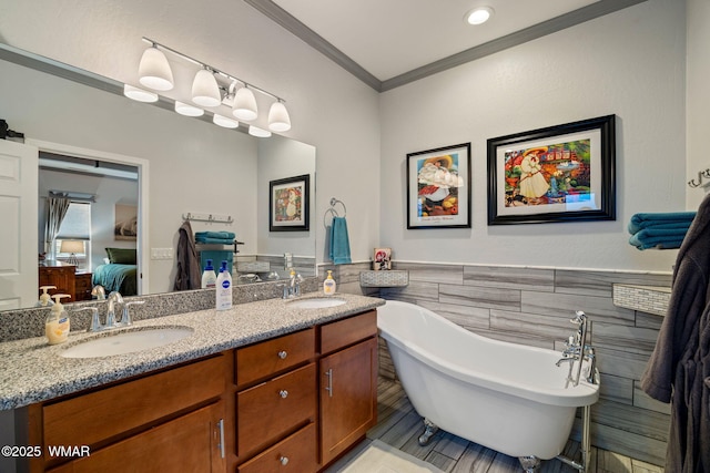 721 S Reynolds Ln, Show Low, AZ 85901 - ensuite bathroom with tile walls, double vanity, crown molding, a freestanding tub, and tile patterned floors