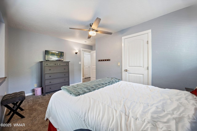 bedroom featuring dark carpet, baseboards, and ceiling fan