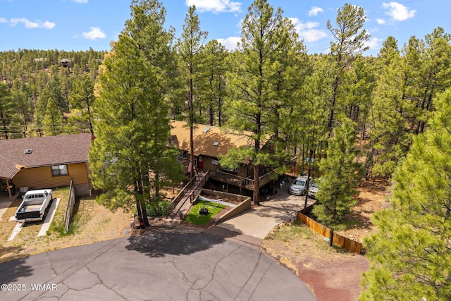 view of subject property featuring a forest