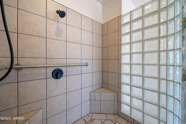 full bath featuring tiled shower