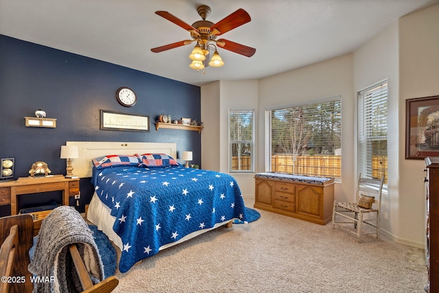 bedroom with baseboards, carpet, and a ceiling fan