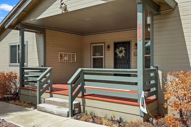 property entrance featuring covered porch