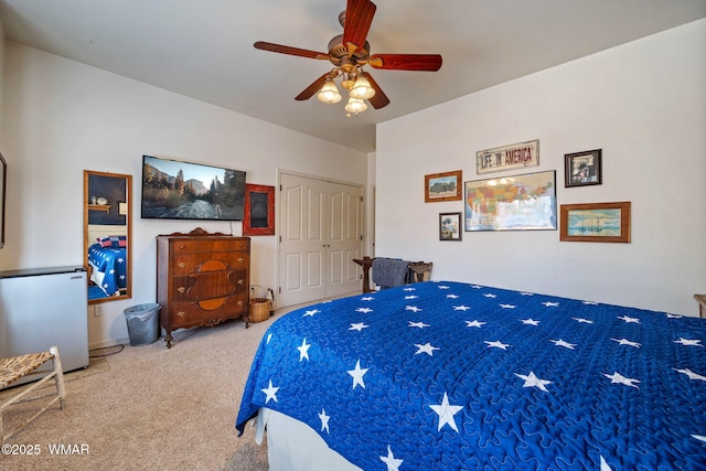 bedroom featuring a closet, ceiling fan, and carpet floors