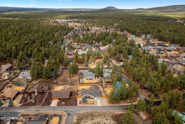 aerial view with a residential view and a view of trees