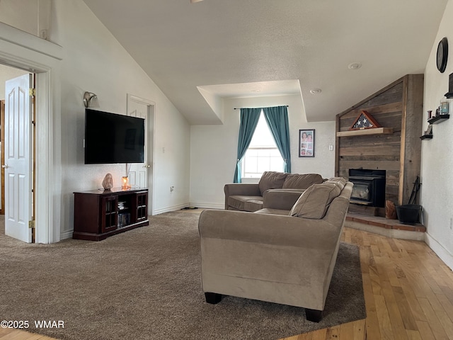 8515 Pueblo Ln, Snowflake, AZ 85937 - living room with lofted ceiling, a wood stove, and wood-type flooring