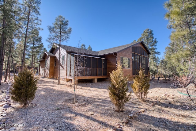 811 S Rockcress Ln, Show Low, AZ 85901 - view of side of home featuring a sunroom and a shingled roof