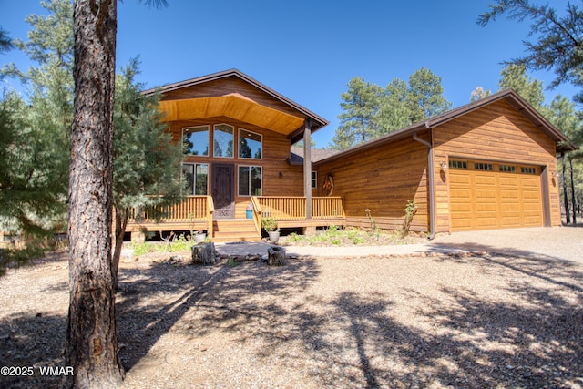 811 S Rockcress Ln, Show Low, AZ 85901 - chalet / cabin with concrete driveway, a garage, and a wooden deck