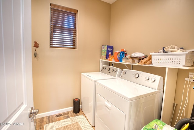 811 S Rockcress Ln, Show Low, AZ 85901 - laundry room with washer and clothes dryer, baseboards, and wood finished floors