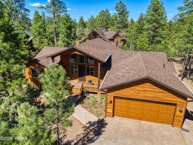 811 S Rockcress Ln, Show Low, AZ 85901 - rustic home featuring roof with shingles, a chimney, and asphalt driveway