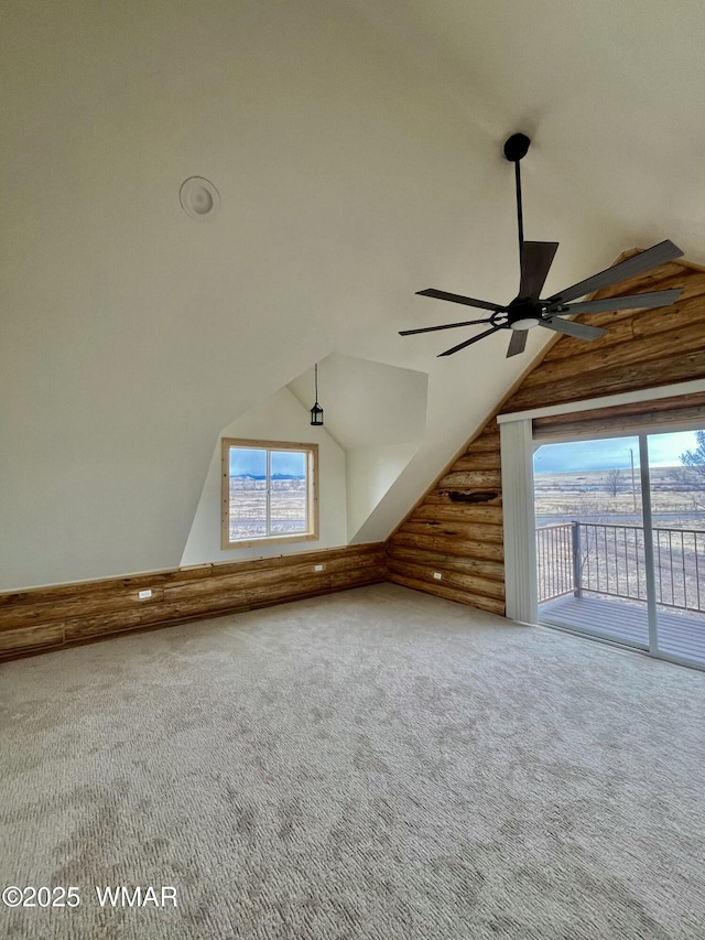 446 Becker Lake Rd, Springerville, AZ 85938 - bonus room featuring a ceiling fan, log walls, lofted ceiling, and carpet flooring