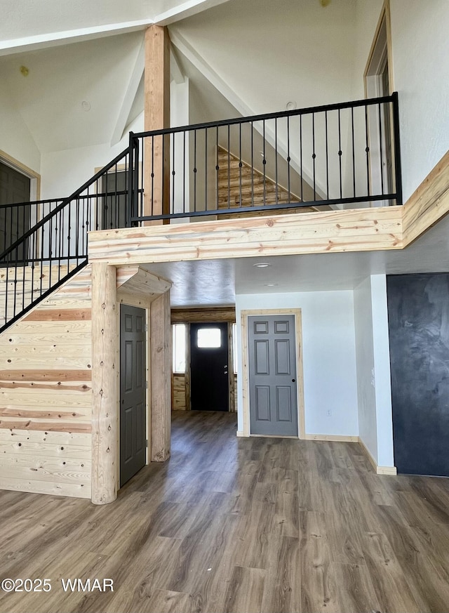 446 Becker Lake Rd, Springerville, AZ 85938 - entrance foyer featuring beamed ceiling, stairs, high vaulted ceiling, and wood finished floors