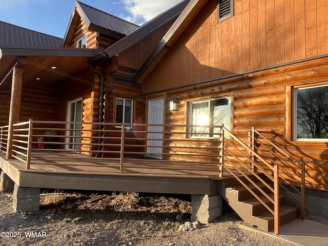 446 Becker Lake Rd, Springerville, AZ 85938 - view of side of property with a deck, log exterior, and metal roof