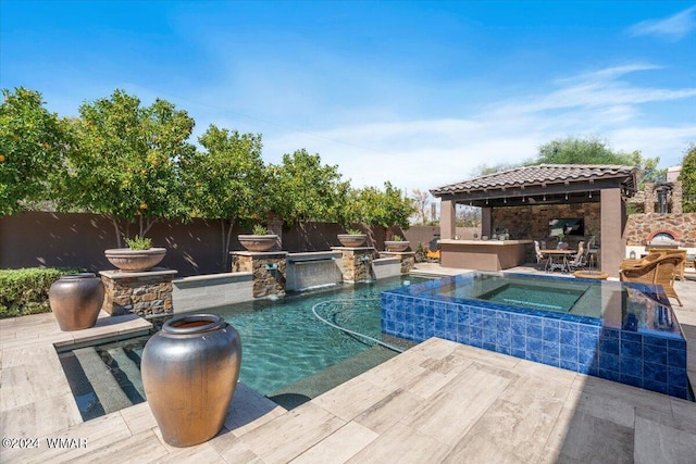 view of pool with a fenced in pool, a fenced backyard, a gazebo, and an in ground hot tub