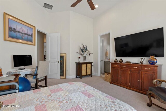 bedroom featuring light carpet, ensuite bathroom, visible vents, and baseboards