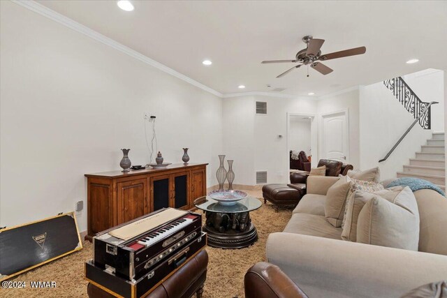 living area featuring stairs, visible vents, and crown molding