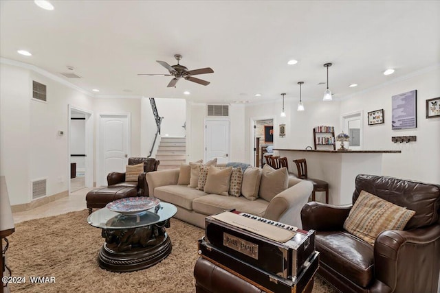 living room featuring stairway, visible vents, and recessed lighting