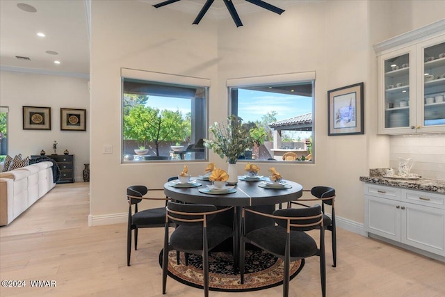 dining room with visible vents, baseboards, light wood-style flooring, ceiling fan, and recessed lighting