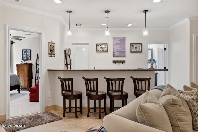 living area featuring light tile patterned floors, wet bar, recessed lighting, and crown molding