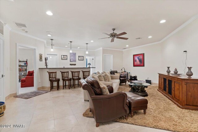 living room with ornamental molding, recessed lighting, and visible vents