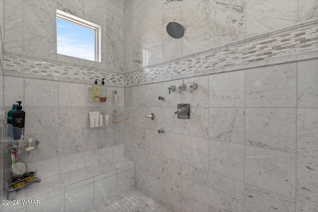 bathroom featuring tiled shower