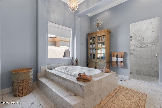 full bathroom featuring an inviting chandelier, tiled shower, baseboards, and a bath