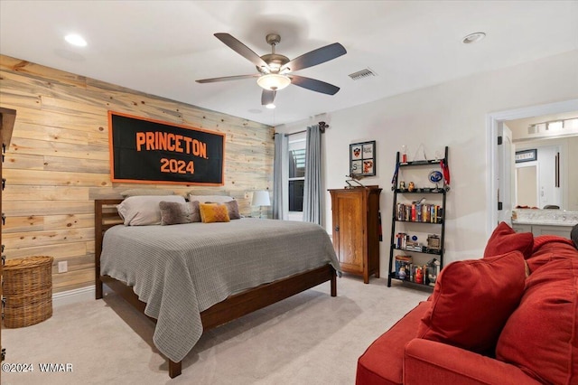 bedroom with wooden walls, visible vents, a ceiling fan, light colored carpet, and recessed lighting