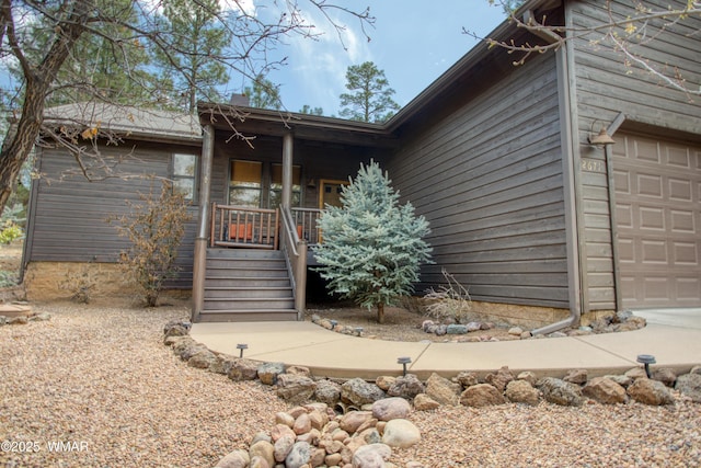 property entrance with an attached garage