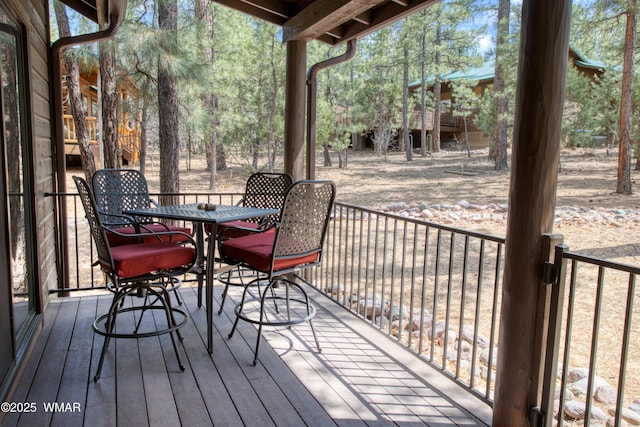wooden deck with outdoor dining area
