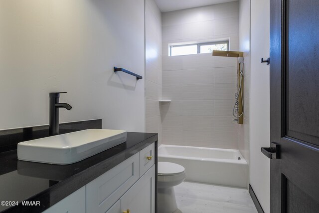 bathroom featuring shower / tub combination, vanity, and toilet