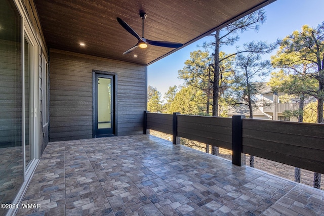 exterior space featuring a ceiling fan