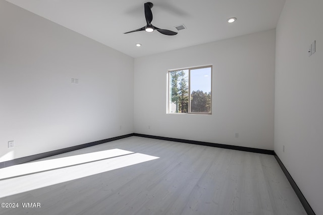 unfurnished room with ceiling fan, recessed lighting, visible vents, baseboards, and light wood-style floors