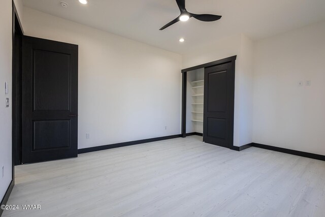 unfurnished bedroom with light wood finished floors, ceiling fan, baseboards, and recessed lighting