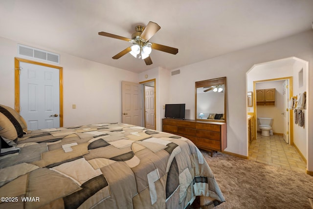 bedroom featuring a ceiling fan, baseboards, visible vents, and light colored carpet