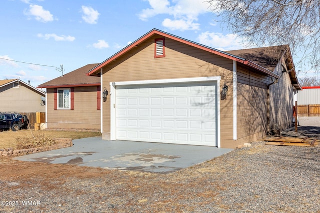 ranch-style house with a garage, driveway, crawl space, and fence