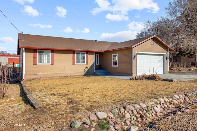 ranch-style house featuring concrete driveway, an attached garage, a front yard, crawl space, and fence