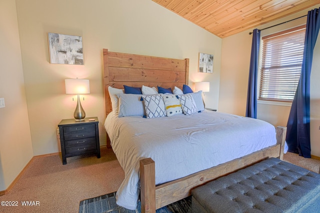 carpeted bedroom featuring lofted ceiling, wood ceiling, and baseboards