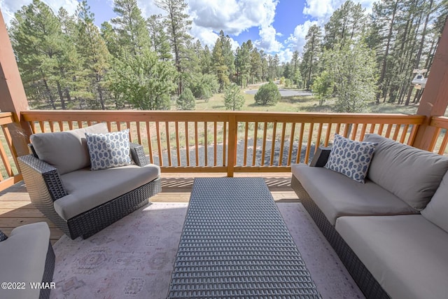 wooden terrace with outdoor lounge area