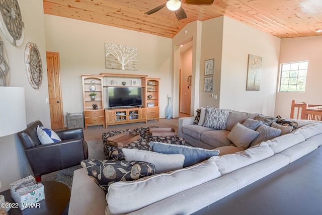 living area featuring vaulted ceiling, ceiling fan, carpet, and wood ceiling