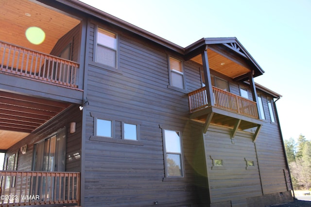 view of home's exterior with a balcony