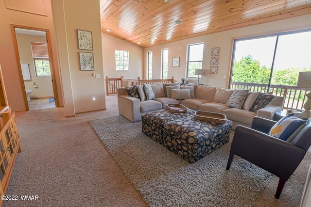 living room with wooden ceiling, carpet flooring, vaulted ceiling, and baseboards